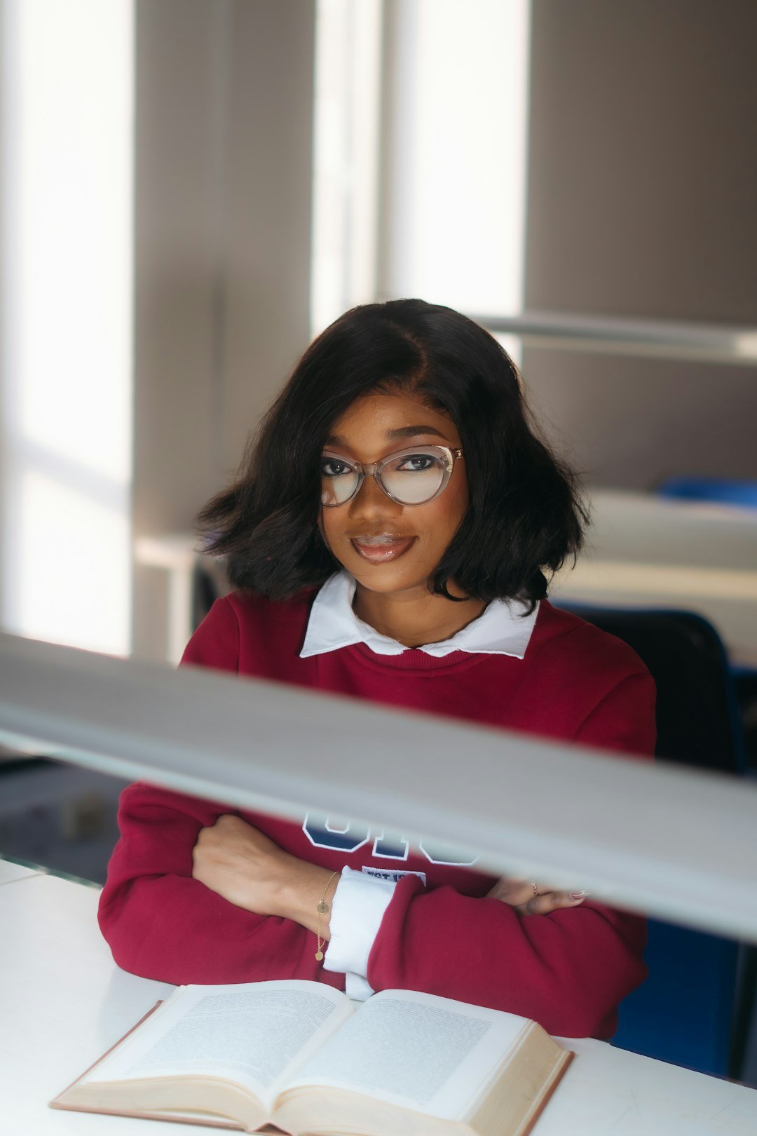 Learner reading a textbook during a quiet study period