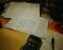 Calculator, study papers, pens and mathematics notes